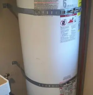 Water heater with seismic strapping and expansion tank