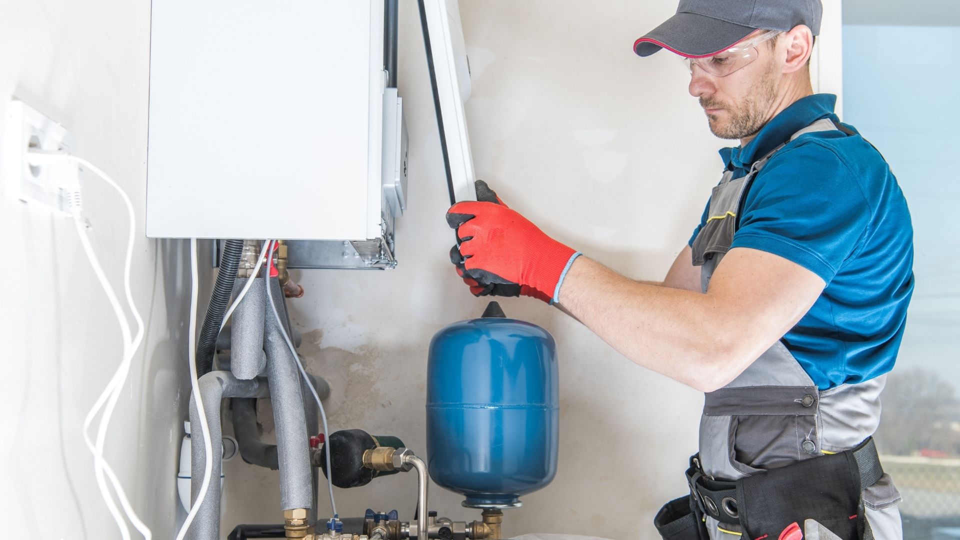 Licensed technician performing water heater installation in San Diego home