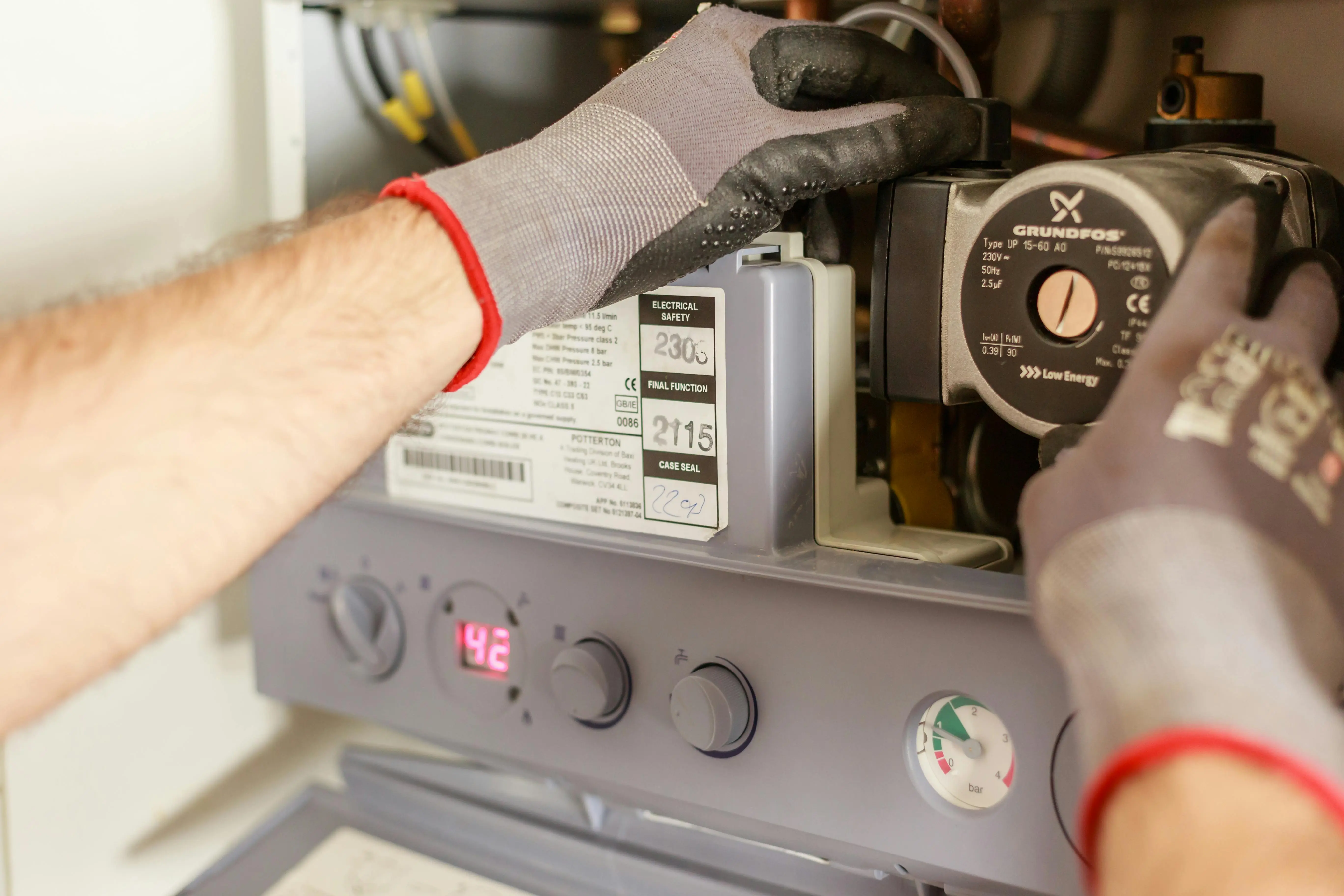 Professional plumber installing gas line for tankless water heater