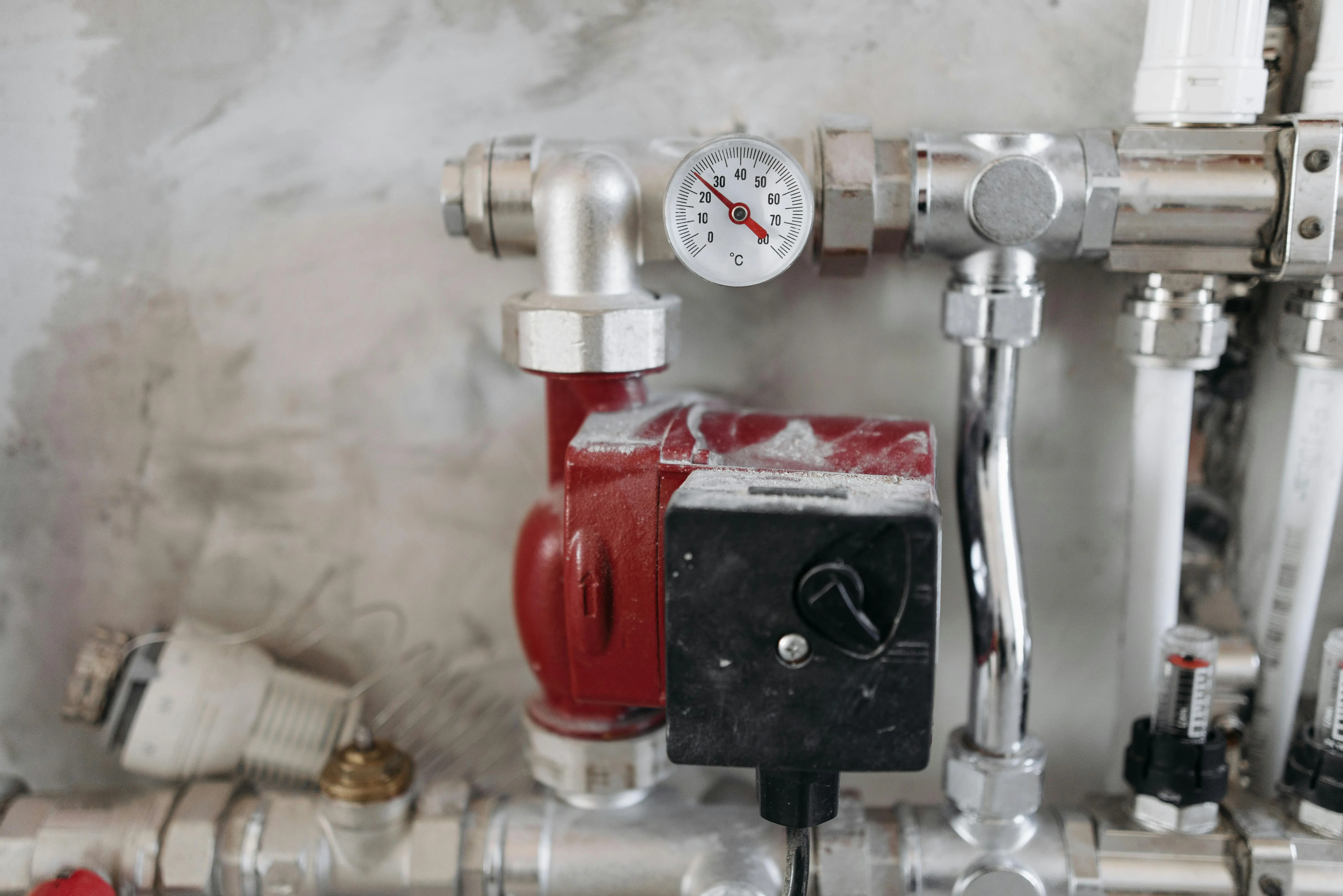 Digital display panel of tankless water heater showing temperature settings